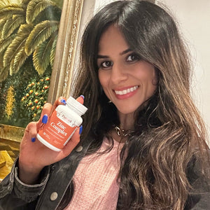 A satisfied female customer proudly displays a bottle of Pattern Wellness Zinc Complex.