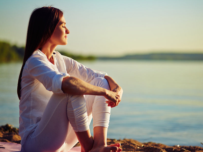 A woman relaxing on the beach.