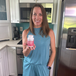 A satisfied female customer proudly displays a bottle of Pattern Wellness Menopause Complex.