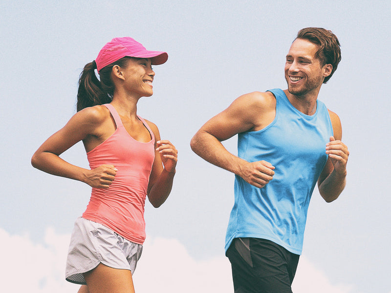 A man and woman jogging side by side.