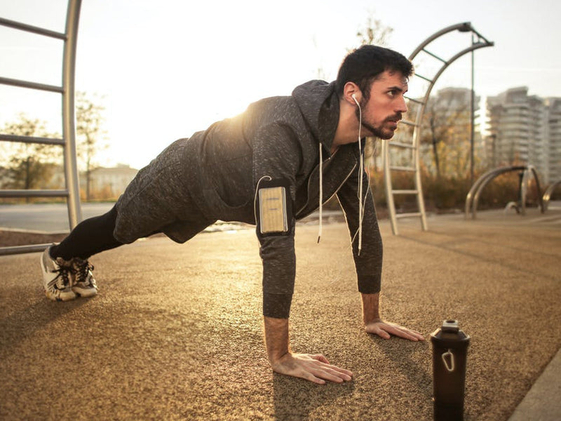 A man performing push-ups on the ground.